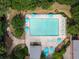 Aerial view of a pool and surrounding area with lounge chairs, umbrellas, and trees at 383 Ralph Mcgill Ne Blvd # J, Atlanta, GA 30312