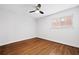 Bright bedroom with hardwood floors, a ceiling fan, and a large window offering natural light at 383 Ralph Mcgill Ne Blvd # J, Atlanta, GA 30312