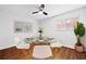 Cozy dining room featuring a glass table, four chairs, hardwood floors, and modern decor at 383 Ralph Mcgill Ne Blvd # J, Atlanta, GA 30312
