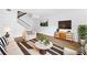 Living room with hardwood floors, modern furniture, stairs, and white walls at 383 Ralph Mcgill Ne Blvd # J, Atlanta, GA 30312