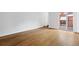 Spacious room with hardwood floors and sliding glass door leading to a balcony at 383 Ralph Mcgill Ne Blvd # J, Atlanta, GA 30312