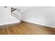 Bright, empty living room with hardwood floors and staircase at 383 Ralph Mcgill Ne Blvd # J, Atlanta, GA 30312
