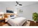 Bedroom with a large window, modern decor, a ceiling fan, and hardwood floors at 383 Ralph Mcgill Ne Blvd # J, Atlanta, GA 30312