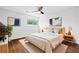 Bedroom with a large window, modern decor, a ceiling fan, and hardwood floors at 383 Ralph Mcgill Ne Blvd # J, Atlanta, GA 30312