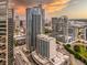 Attractive aerial view of a building and the surrounding skyscrapers with a rooftop pool at 400 W Peachtree Nw St # 3711, Atlanta, GA 30308