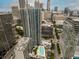 Beautiful aerial shot of the city buildings and a rooftop pool and greenery at 400 W Peachtree Nw St # 3711, Atlanta, GA 30308