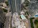 A high-rise and surrounding buildings with a rooftop pool area at 400 W Peachtree Nw St # 3711, Atlanta, GA 30308
