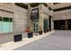 Building entrance in a commercial area featuring planters and modern architecture at 400 W Peachtree Nw St # 3711, Atlanta, GA 30308