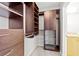 Custom closet features shelves, drawers, hanging rods and pull-out metal storage baskets for ultimate organization at 400 W Peachtree Nw St # 3711, Atlanta, GA 30308