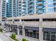High-rise building showing the exterior, concrete facade, balconies, and commercial space at the ground floor at 400 W Peachtree Nw St # 3711, Atlanta, GA 30308