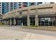 Building exterior featuring storefront retail space at the bottom of a high-rise residential building at 400 W Peachtree Nw St # 3711, Atlanta, GA 30308
