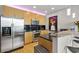 Modern kitchen featuring stainless steel appliances, black backsplash, granite countertops and bar seating at 400 W Peachtree Nw St # 3711, Atlanta, GA 30308