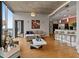 Open-concept living room and kitchen with modern bar stools and light-filled space at 400 W Peachtree Nw St # 3711, Atlanta, GA 30308