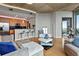 Contemporary living room boasts an open floor plan, integrating kitchen and living areas at 400 W Peachtree Nw St # 3711, Atlanta, GA 30308