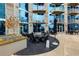 Exterior patio area with outdoor seating, lounge chairs, and tables with umbrellas at 400 W Peachtree Nw St # 3711, Atlanta, GA 30308