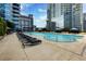 Outdoor swimming pool area featuring lounge chairs and a large pool with a skyline view at 400 W Peachtree Nw St # 3711, Atlanta, GA 30308