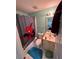 Bright bathroom with Spider-Personal shower curtain, vanity, toilet, and blue walls at 199 Scenic View Ln, Stone Mountain, GA 30087