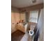 Standard bathroom includes a white tiled floor, toilet, tub and vanity with sink at 199 Scenic View Ln, Stone Mountain, GA 30087