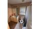 Standard bathroom includes a white tiled floor, toilet, tub and vanity with sink at 199 Scenic View Ln, Stone Mountain, GA 30087