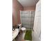 Cozy bathroom featuring a sink, toilet, and shower with shower curtain at 199 Scenic View Ln, Stone Mountain, GA 30087