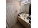 Bathroom with a sink, vanity with storage, and a large mirror at 199 Scenic View Ln, Stone Mountain, GA 30087