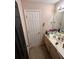 Traditional bathroom featuring a cream vanity and standard fixtures at 199 Scenic View Ln, Stone Mountain, GA 30087