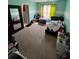Bedroom featuring neutral carpeting, and a bed, lit by a window with bright curtains at 199 Scenic View Ln, Stone Mountain, GA 30087
