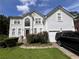 Exterior view of a two story home with white exterior and driveway at 199 Scenic View Ln, Stone Mountain, GA 30087
