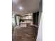 Bright eat-in kitchen features white cabinets, stainless appliances, granite counters, and modern lighting at 199 Scenic View Ln, Stone Mountain, GA 30087
