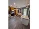 Bright eat-in kitchen features white cabinets, stainless appliances, granite counters, and modern lighting at 199 Scenic View Ln, Stone Mountain, GA 30087
