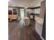 Bright eat-in kitchen features white cabinets, stainless appliances, granite counters, and modern lighting at 199 Scenic View Ln, Stone Mountain, GA 30087