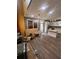 Bright eat-in kitchen features white cabinets, stainless appliances, granite counters, and modern lighting at 199 Scenic View Ln, Stone Mountain, GA 30087
