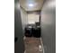 Well-lit laundry room features gray paint, and modern side-by-side washer and dryer set for efficient laundry at 199 Scenic View Ln, Stone Mountain, GA 30087