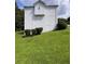 Exterior side view of home with white siding and large green lawn at 199 Scenic View Ln, Stone Mountain, GA 30087