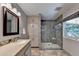 Modern bathroom featuring a glass-enclosed shower, granite counters, and built in storage at 1990 Holly Cove Rd, Cumming, GA 30040