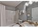 Clean bathroom featuring a shower-tub combo, granite countertop, and modern fixtures at 1990 Holly Cove Rd, Cumming, GA 30040