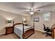 This bedroom features carpet flooring, neutral paint colors, and a ceiling fan for added comfort at 1990 Holly Cove Rd, Cumming, GA 30040