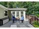 This cozy deck provides a tranquil retreat with comfortable seating, perfect for relaxation at 1990 Holly Cove Rd, Cumming, GA 30040