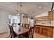 Open dining room next to kitchen with hardwood floors and natural light at 1990 Holly Cove Rd, Cumming, GA 30040