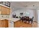 A dining room with hardwood floors, a modern chandelier, and a view into the kitchen at 1990 Holly Cove Rd, Cumming, GA 30040