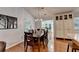 Dining room with hardwood floors, adjacent to the kitchen and sunny breakfast room at 1990 Holly Cove Rd, Cumming, GA 30040