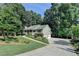 Traditional style home with a two-car garage and landscaped front yard at 1990 Holly Cove Rd, Cumming, GA 30040