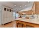 Kitchen features light cabinets, granite countertops and hardwood floors at 1990 Holly Cove Rd, Cumming, GA 30040