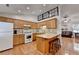 Bright kitchen with hardwood floors, cabinets and breakfast bar at 1990 Holly Cove Rd, Cumming, GA 30040