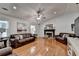 Comfortable living room with hardwood floors, fireplace, and neutral décor at 1990 Holly Cove Rd, Cumming, GA 30040