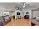 Spacious living room leading to the kitchen with hardwood floors and seating at 1990 Holly Cove Rd, Cumming, GA 30040