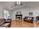 Bright living room featuring hardwood floors, fireplace, and ample seating at 1990 Holly Cove Rd, Cumming, GA 30040