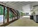 The covered patio features stairs to the backyard, offering a convenient outdoor space at 1990 Holly Cove Rd, Cumming, GA 30040