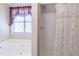 The bathroom features a separate tub and shower at 2325 Sailor Ln, Suwanee, GA 30024