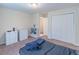 Bedroom featuring a large closet, carpeted floor, neutral walls, and ample storage at 2325 Sailor Ln, Suwanee, GA 30024